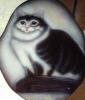 cat on a wooden plaque by Can Yucel